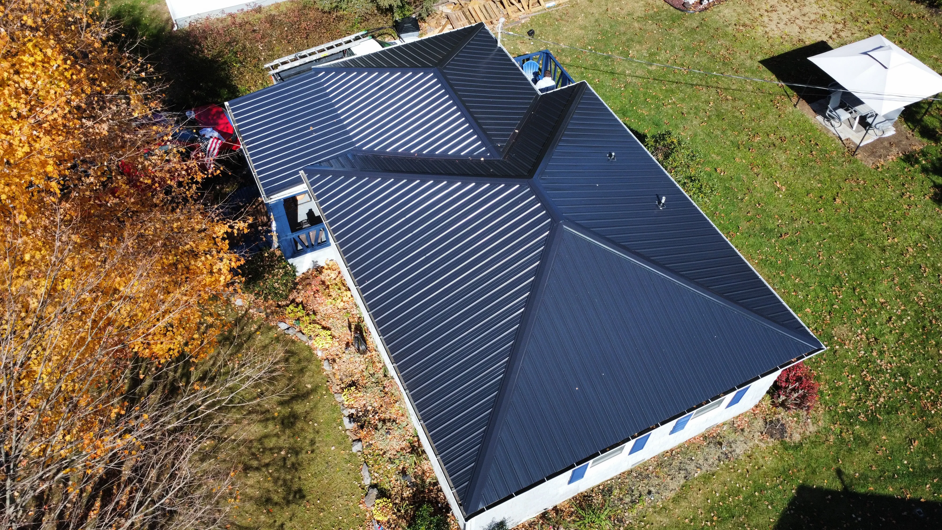 Aerial view of a home with a new black standing-seam metal roof in Bristol, TN