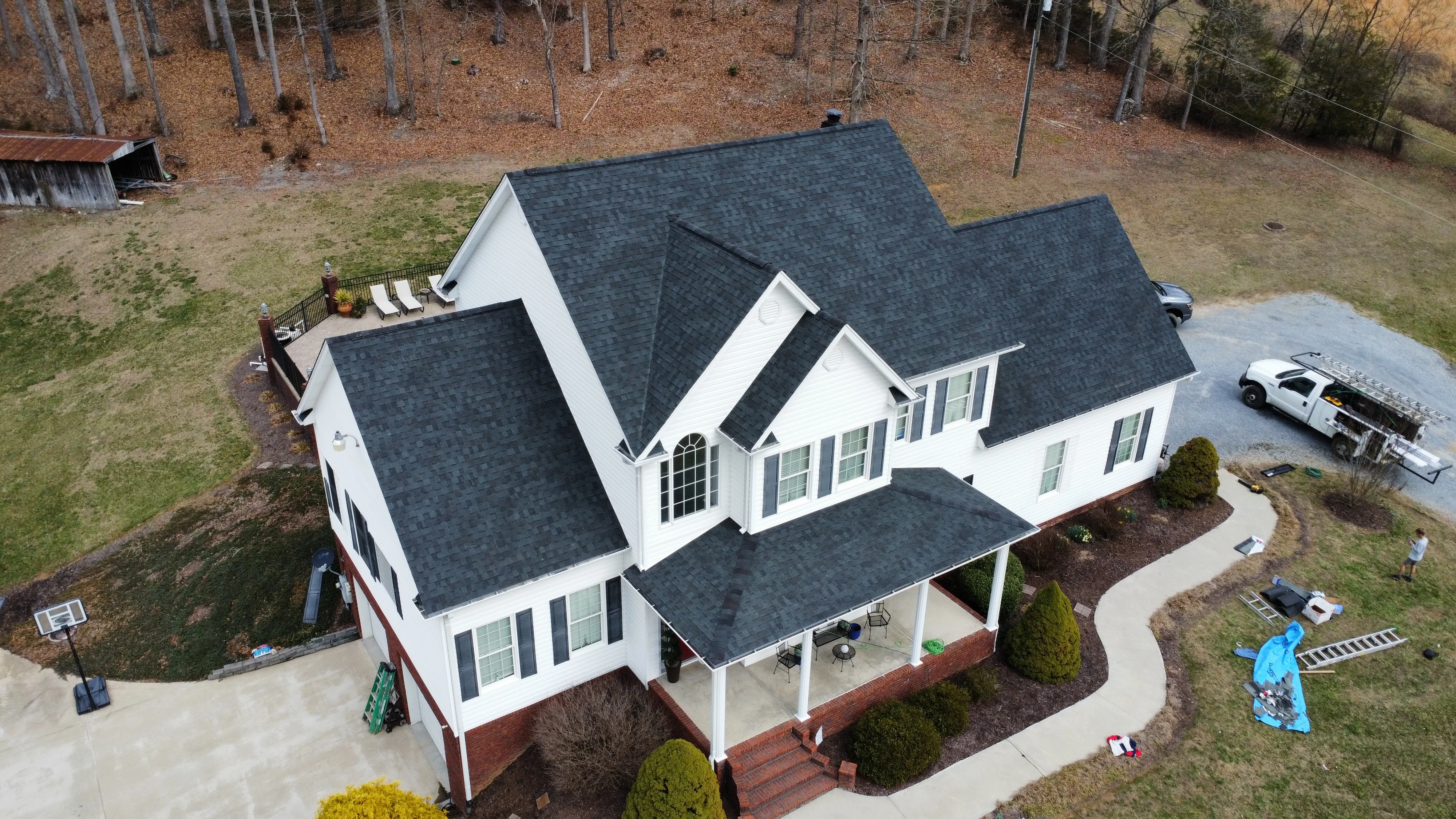 Two-story home with a dark grey shingle roof - roofing in Bristol, TN